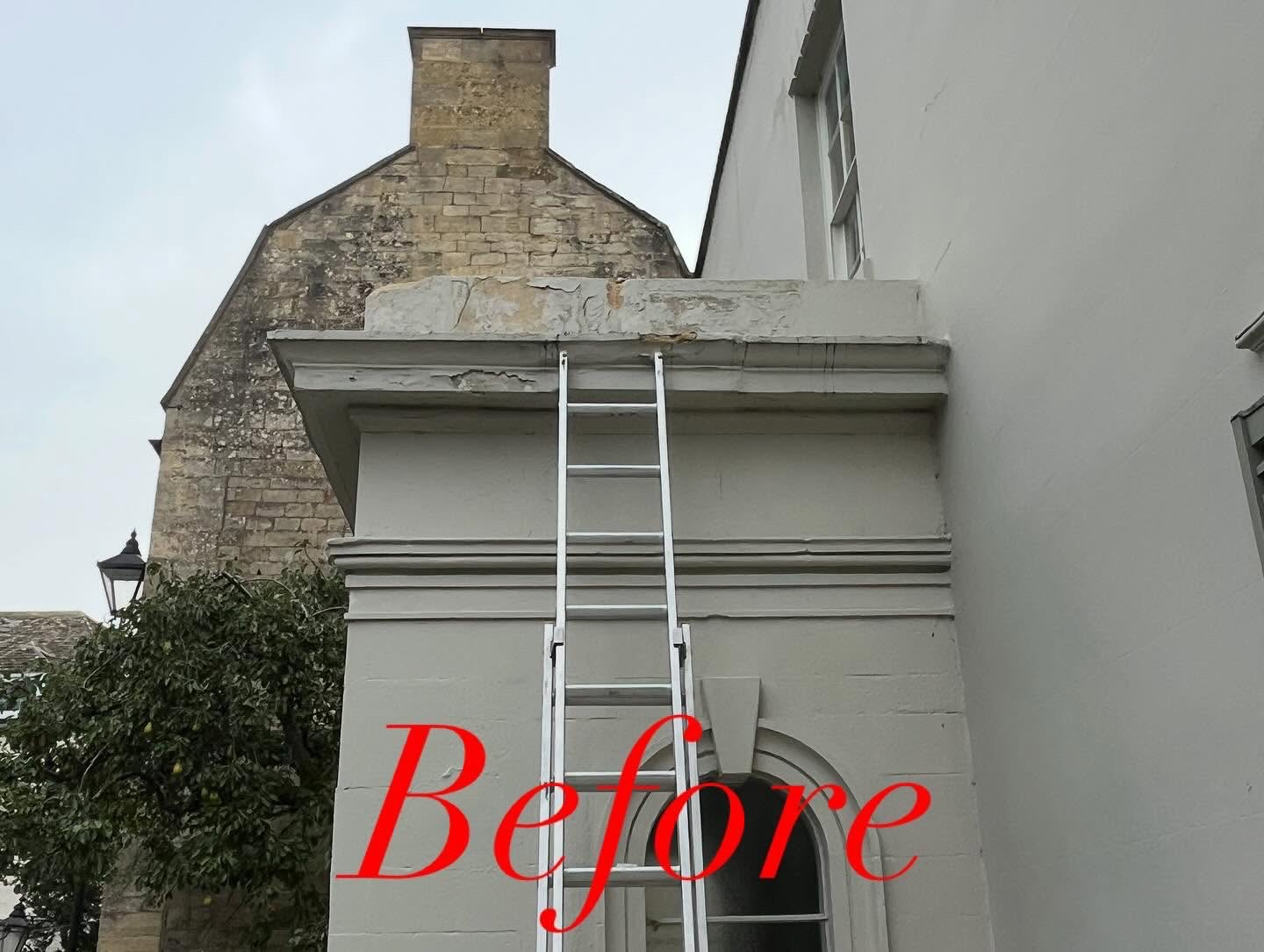 Decayed stone cornice and parapet on top of a classical porch, spalled and broken away, with ladders up against it